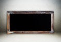 Blank vintage chalk board on cement wall background