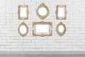 Blank vintage frames hanging on white brick wall. Mockup for design Royalty Free Stock Photo