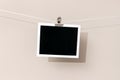 Blank Vintage instant photo frame hanging on a rope Royalty Free Stock Photo