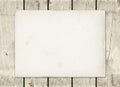 Blank vintage paper sheet on a white wood board Royalty Free Stock Photo