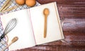 Blank vintage recipe book, eggs and spoon on the wooden background. Top view. Place for text. Banner Royalty Free Stock Photo