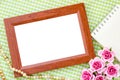 Blank vintage wooden photo frame and open diary Royalty Free Stock Photo