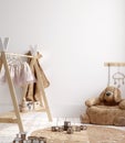 Blank wall mock up in cozy nursery interior background, Scandinavian style Royalty Free Stock Photo