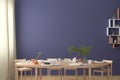 Blank wall mock up in the dinning room with served table Royalty Free Stock Photo