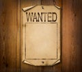 Blank wanted poster on wooden background Royalty Free Stock Photo