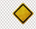 Blank warning sign at rusty fence Royalty Free Stock Photo