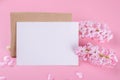 Blank wedding invitation stationery card mockup with envelope on pink background with hyacinth flowers and pink heart Royalty Free Stock Photo