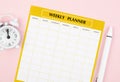 The Blank weekly plan notice block with alarm clock with pink on pink color background. Empty schedule