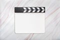 Blank white acrylic clapboard on natural marble texture