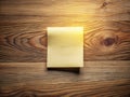 Blank White Adhesive Note on a Rustic Wooden Desk A Versatile Mockup for Branding and Design Projects Royalty Free Stock Photo