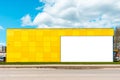 Blank white advertisement,billboard,business sign mockup mounted on the yellow wall of a small business workshop store