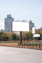 Blank white advertising banners near the road in autumn