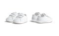 Blank white baby shoes pair mockup, half-turned view, side back