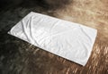 Blank white beach towel mockup on textured floor Royalty Free Stock Photo