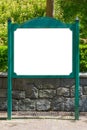 Blank white billboard green signpost in the park. Royalty Free Stock Photo