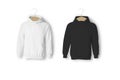 Blank white and black hoodies mockup isolated over white background. Handing on a wooden hanger unisex hoodies.