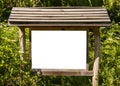 A blank white board in a forest for information ,sign for advert Royalty Free Stock Photo