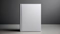 A blank white book standing upright on a plain grey background, a concept of branding mockup. Generative AI Royalty Free Stock Photo