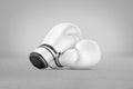 Blank white boxing gloves pair mockup lying, grey background Royalty Free Stock Photo