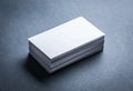 Blank white business card on grey background Royalty Free Stock Photo