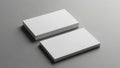 Blank white business card stack mockup on a solid gray background Royalty Free Stock Photo