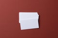 Blank white business cards on burgundy paper background Royalty Free Stock Photo
