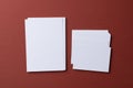 Blank white business cards on burgundy paper background Royalty Free Stock Photo