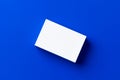 Blank white businesscards on classic blue background Royalty Free Stock Photo