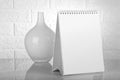 Blank White Calendar for Mockup with a Flower Vase Royalty Free Stock Photo