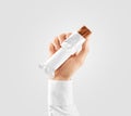 Blank white candy bar plastic wrap opened mockup hold hand Royalty Free Stock Photo