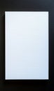 Blank white canvas on black wall: minimalist art display with subtle textures Royalty Free Stock Photo
