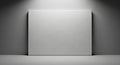 Blank White Canvas Mounted on a Gray Wall with Dramatic Spotlight Illumination empty Royalty Free Stock Photo