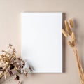 Blank White Canvas Mockup with Dried Floral on Beige Background Royalty Free Stock Photo