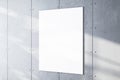Blank white canvas mockup on a textured concrete wall in daylight. Display concept. Royalty Free Stock Photo
