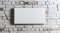 Blank white canvas mounted on a textured brick wall with a partially painted surface. The minimalist scene emphasizes Royalty Free Stock Photo