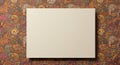 A blank white canvas is placed on a colorful, intricate background featuring an array Royalty Free Stock Photo