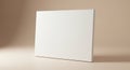 Blank white canvas positioned upright against a neutral beige background. The Royalty Free Stock Photo