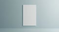 A blank white canvas or poster board hangs on a plain light blue wall. The scene is Royalty Free Stock Photo