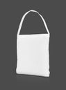 Blank white canvas shopping tote bag isolated on gray background