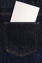 Blank white card in the back pocket of dark blue jeans. Copy space Royalty Free Stock Photo