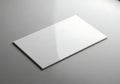 Blank white card mockup on a textured gray surface Royalty Free Stock Photo