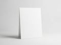 A blank white card standing upright against a plain background Royalty Free Stock Photo