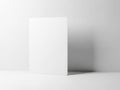 Blank white card standing upright on white surface isolated on white background Royalty Free Stock Photo