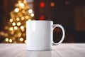 Blank white ceramic mug mock-up on the blurred Christmas background. Royalty Free Stock Photo