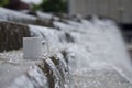 A blank white coffee mug on the long water fountain Royalty Free Stock Photo