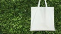 blank white cotton bag on green leavs background. eco friendly Royalty Free Stock Photo