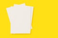 Blank white cover magazines stack mockup on yellow background