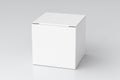 Blank white cube gift box with closed hinged flap lid on white background. Clipping path around box mock up. Royalty Free Stock Photo