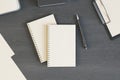 Blank white diaries cover with pen on dark wooden table. Mockup Royalty Free Stock Photo