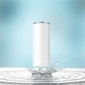 Blank white energy drink can mock-up with water splash 3d render on dark background Royalty Free Stock Photo